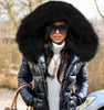 Thea Reynolds Jacket with down-filled sleeves and oversized black fur hood from Livinglife Beauty.