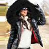 Thea Reynolds Jacket with down-filled sleeves and oversized black fur hood from Livinglife Beauty.